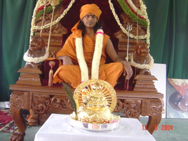 16 - Paramahamsa Sri Nithyananda during the traditional coronation ceremony along with the Kirita, (the golden crown) been offered onto him