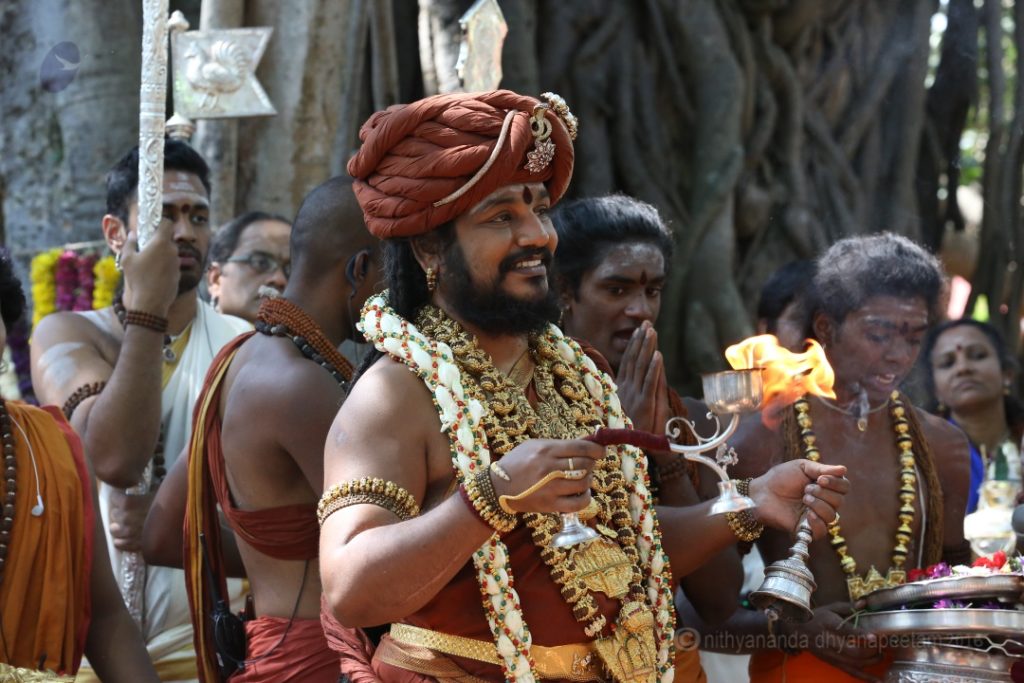Arati to the sacred banyan tree on Avatar Day