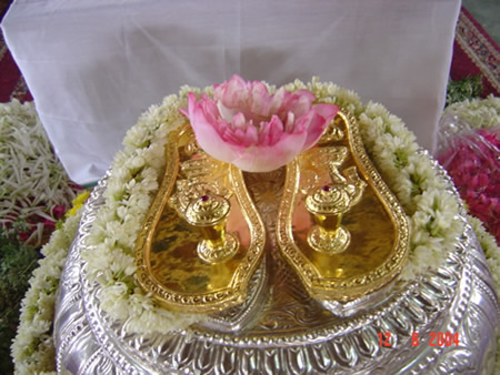 24 - The Svarna Paduka (sacred sandals made of gold) gift offered by Bhagavan Shri Sathya Sai Baba to Paramahamsa Sri Nithyananda Swamiji, with the divine symbols engra